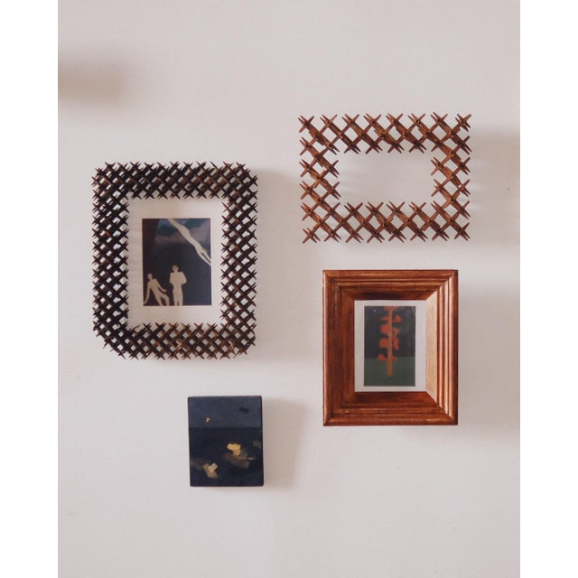 Hundreds of hand-carved pegs, all pressure-fit, no nails. This late 19th century “crown of thorns” frame is as graphic as...