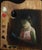 This oil portrait captures a young girl immersed in reading, her serene expression illuminated by soft, ambient light. The...