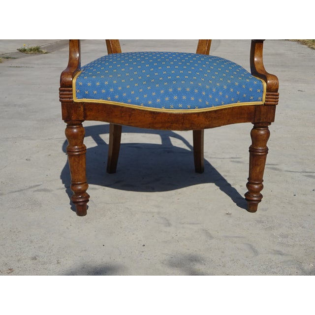 A Louis-Philippe period gondola armchair, traditionally made in France (circa 1850). The frame is solid walnut with a...