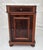 A charming and highly functional American Victorian marble top nightstand, dating to the 1890s, offering a beautiful blend...