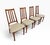 A stylish set of four vintage Danish Modern teak dining chairs, circa 1970s. Featuring tall, slender backs with vertical...