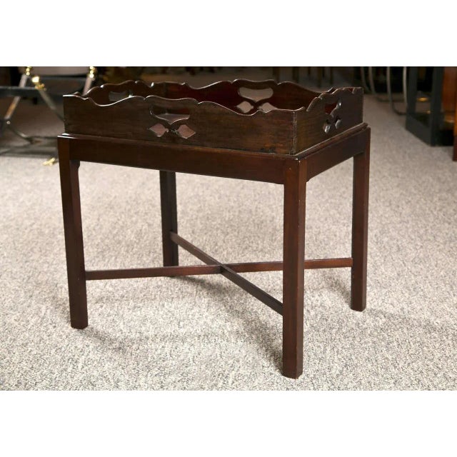 Late 19th century butlers tray on stand. Scalloped detail incorporating open handles for serving. Beautiful mahogany with...