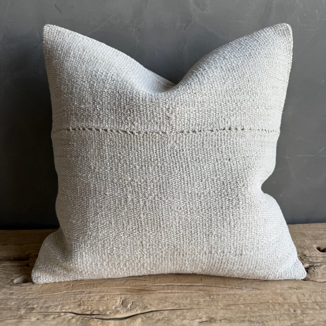 Creamy white hemp rug pillow. Soft hand, linen blend backing with zipper closure. Spot cleaning is recommended, or dry...