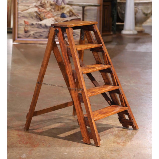 Crafted in France circa 1870, this five-step folding ladder is made from poplar and pine with a warm, timeworn patina that...