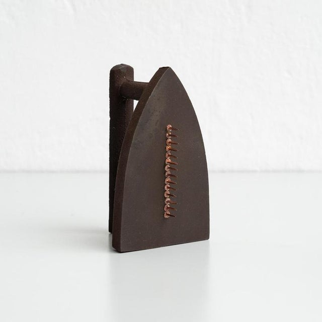Own an iconic piece of surrealist art with Man Ray's Le Cadeau, a striking sculpture produced in 1974 in Italy. This...