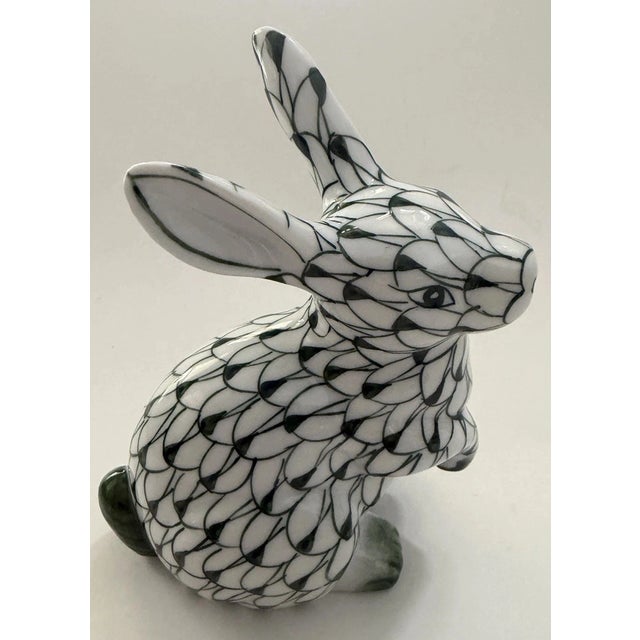 Charming vintage Andrea by Sadek porcelain bunny figurine, featuring a hand-painted green and white fishnet pattern....