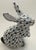 Charming vintage Andrea by Sadek porcelain bunny figurine, featuring a hand-painted green and white fishnet pattern....