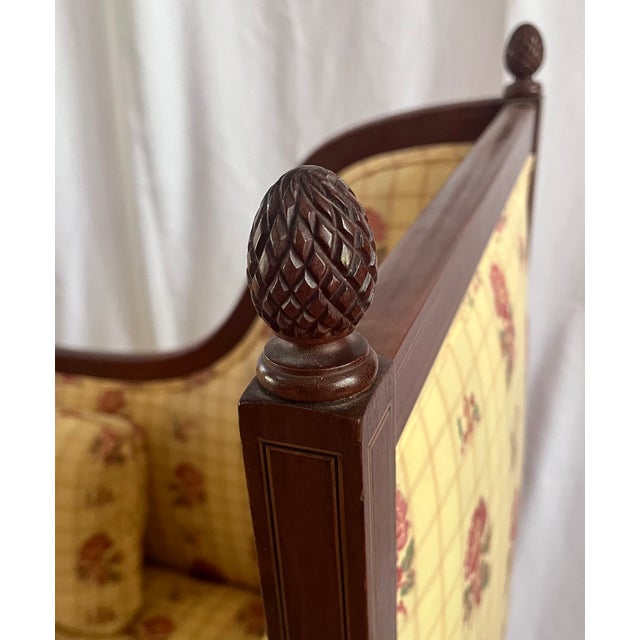 Sheraton style upholstered settee. Floral over plaid fabric. Sofa includes a lumbar pillow and two side bolsters. Dark...