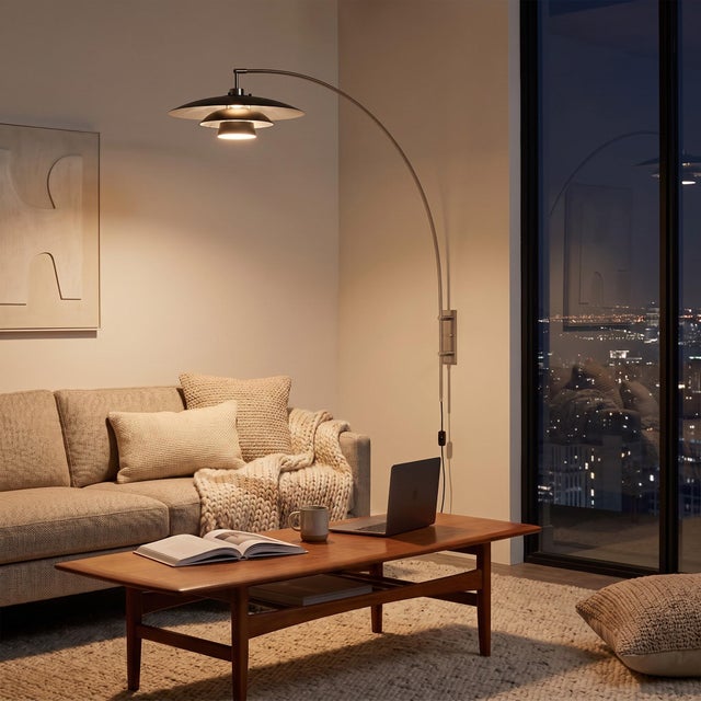 The FLEUR Arc Lamp is a Modern arc lamp with a Satin Nickel steel body and base, featuring a Matte Black/Silver steel...