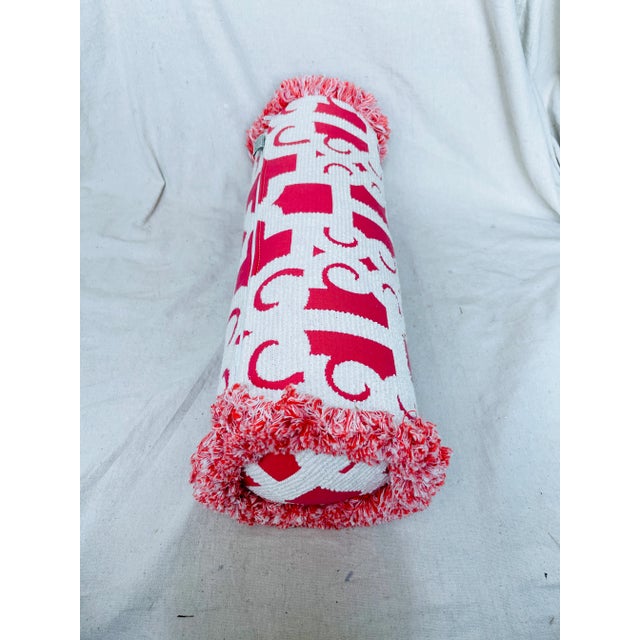 Frontgate Indoor/Outdoor Bolister Pillow in a peony & cream color with fringe trim. Used for staging purposes and is in...