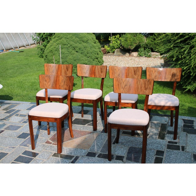 A beautiful set of mid-century living room chairs, restored to its old glory - there were reupholstered and the wood was...