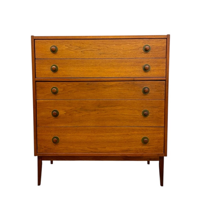 This vintage Mid Century Modern five-drawer dresser is attributed to John Van Koert for Drexel and reflects the clean-...