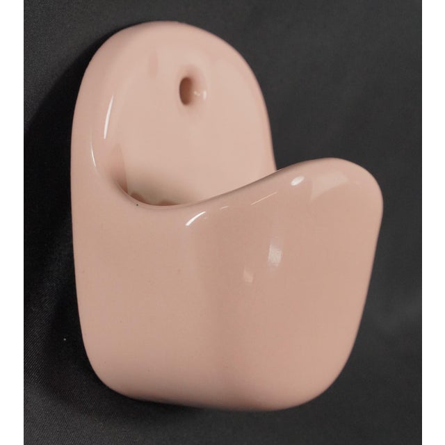 Vintage European surface mount wall soap dish made of pink ceramic with a deep pocket design. The original mounting screws...