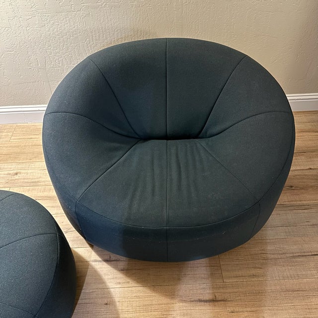 This authentic Ligne Roset "Pumpkin" lounge chair and matching ottoman set is a masterpiece of French furniture history....