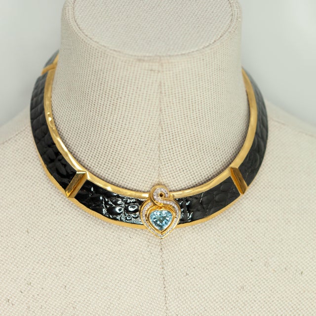 An extraordinary and rare signed Gucci demi-parure, comprising a collar necklace and matching earrings, set with 3 heart-...