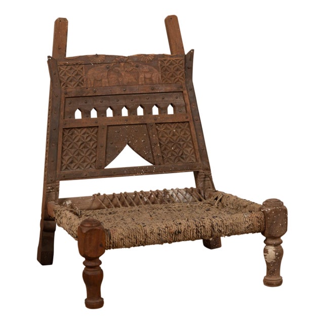 Rustic Indian Low Wooden Chair With Rope Seat and Weathered Appearance For Sale