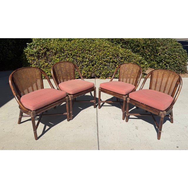 Beautiful vintage dining chairs by luxury brand McGuire of San Francisco. These 4 dining chairs are part of a complete...