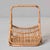 This Italian mid-century magazine basket is a distinctive example of the bamboo and rattan work associated with Franco...