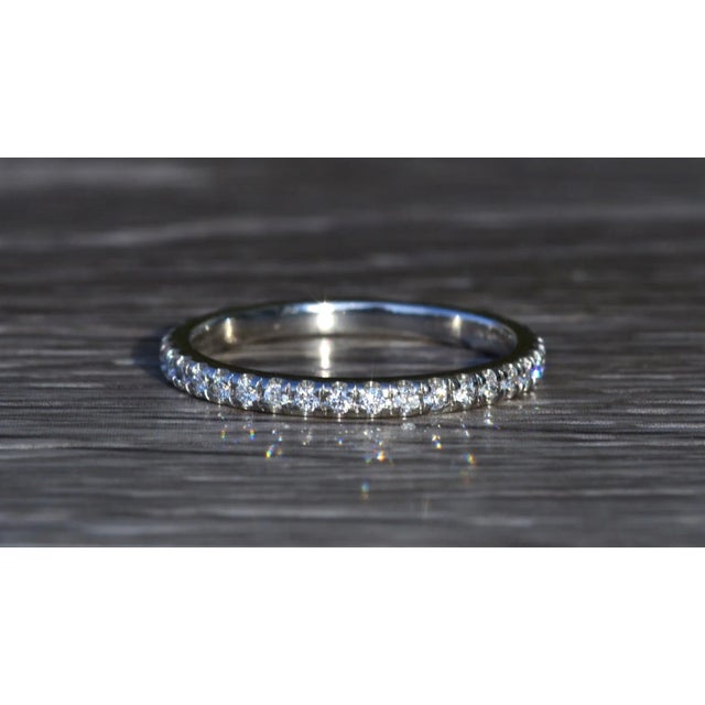 The Caryville: Ladies Platinum 0.20CTW Diamond Eternity Band. Crafted in durable platinum, this ladies eternity band...