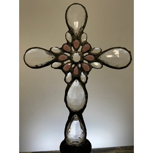 This one-of-a-kind assemblage sculpture pairs a softly tinted pink glass bottle with a handcrafted cross composed of...