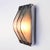 This vintage wall light in polished aluminum, equipped with frosted ribbed glass, offers soft and diffused light. Its...