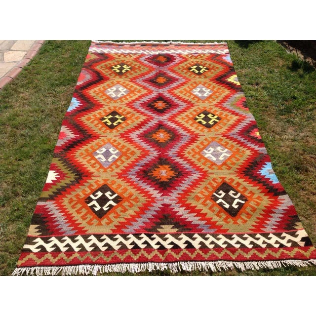 This beautiful, vintage, handwoven kilim is approximately 70 years old. It is handmade of very fine quality, hand-spun...