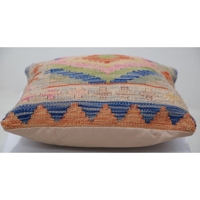 A one-of-a-kind handwoven Afghan wool kilim accent pillow featuring stepped diamond medallion. Cut and sewn by hand from a...