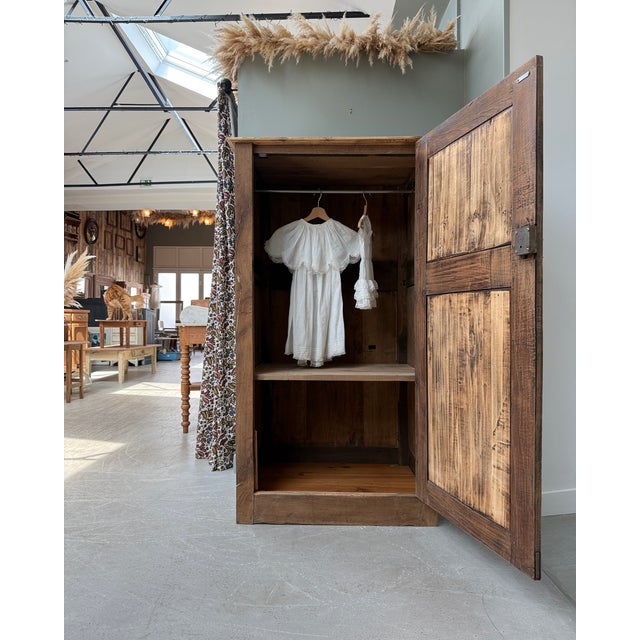 This single-door wardrobe, rooted in 19th-century french peasant tradition, captivates with its raw authenticity and...