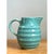 This vintage aqua ribbed ceramic pitcher presents a charming, rounded silhouette, with a full, bulbous belly that narrows...