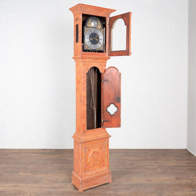 Early 19th century tall grandfather clock from Sweden, long case crafted in pine retaining its original hand painted...