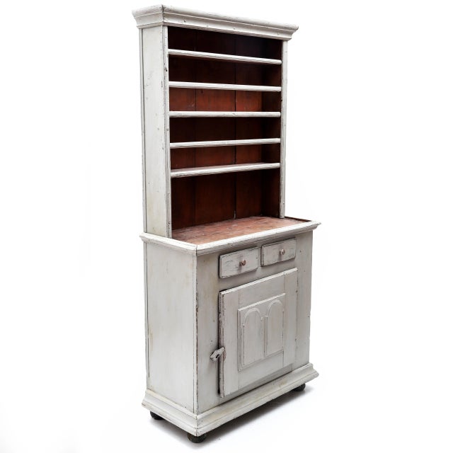 A great Gustavian kitchen cabinet in light gray setting from the 19th century is this piece of furniture. Two drawers and...