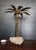 Brutalist palm tree lamp in gilded brass on a block of Kimmeridgian rock. European Plug (up to 250V).The wiring of this...