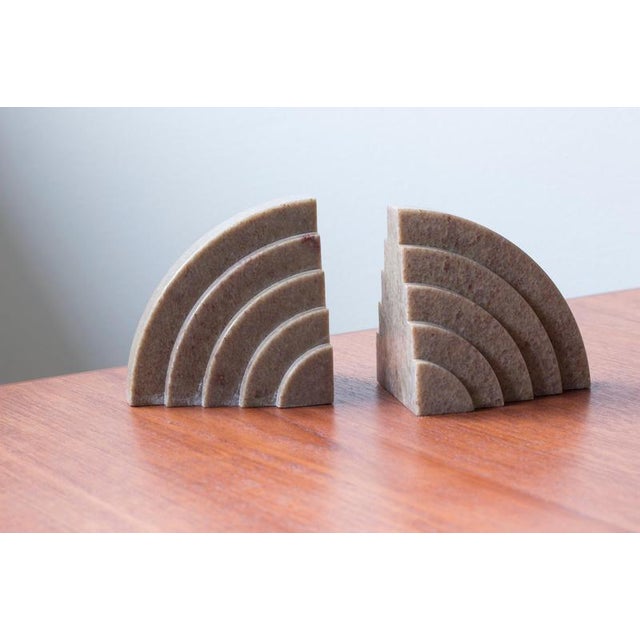 Geometrical Art deco bookends made from marble stone in a light pink color. Made in Scandinavia during the 1920s. Typical...