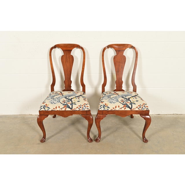 A gorgeous pair of Queen Anne or Georgian style side chairs or dining chairs By Baker Furniture USA, Circa 1980s Solid...