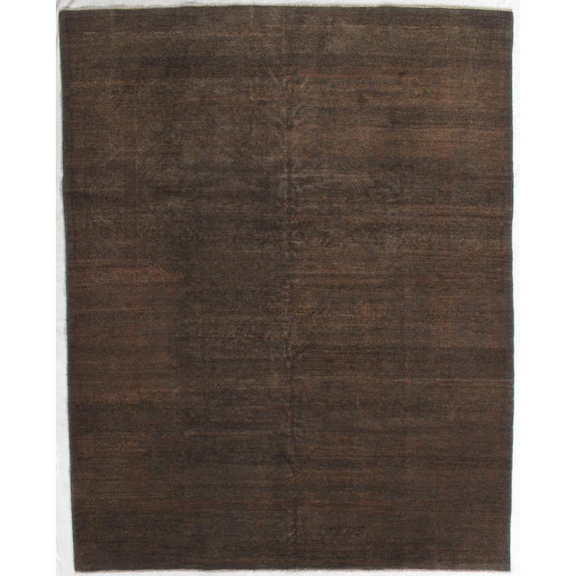 Vintage hand-knotted Gabbeh rug with an all-over distressed field and faint traditional pattern. Woven in wool with a low-...