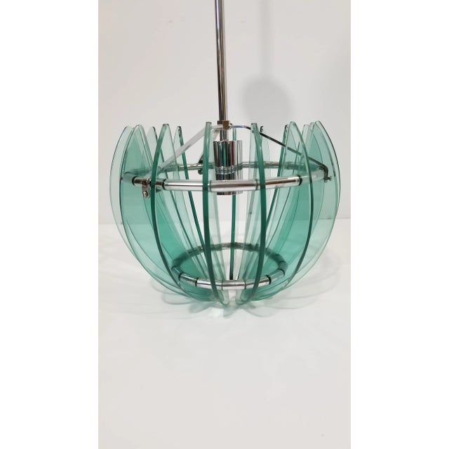 Stunning Vintage Italian Chandelier/Pendant Light. Consists of a ring of half moon green glass panels surrounding a chrome...