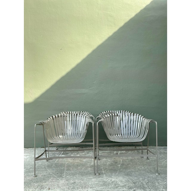 Elevate your outdoor living space with this iconic set of four "Sunburst" strap lounge chairs by Woodard. A quintessential...