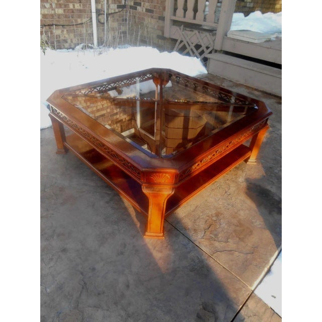 This beautiful table was probably a showroom Sample as it is like new and is made from mahogany and has pierced fretwork...