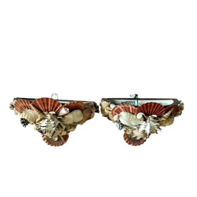 Vintage Pair of Shell-Encrusted Coastal Wall Sconces. Each demi-lune sconce is adorned with an artful arrangement of...