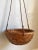 Offering a truly exquisite mid-20th century hanging basket planter of handwoven natural rattan and jute roping. This...