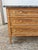 A refined 19th-century French Louis XVI commode crafted from beautifully bleached chestnut, featuring a striking gray...