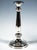 Two festive Biedermeier silver candlesticks on a stepped, curved base featuring a chased decorative band with small...