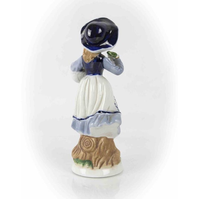 Porcelain dame is an original decorative object realized in the half of the 20th century. Marked under the base.
