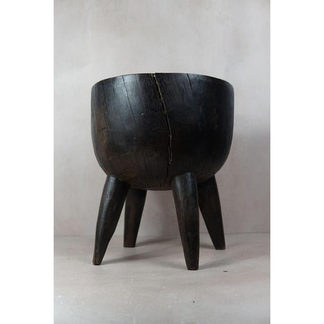 Introduce a touch of African elegance into your living space with this remarkable solid wood carved side table\.tool from...