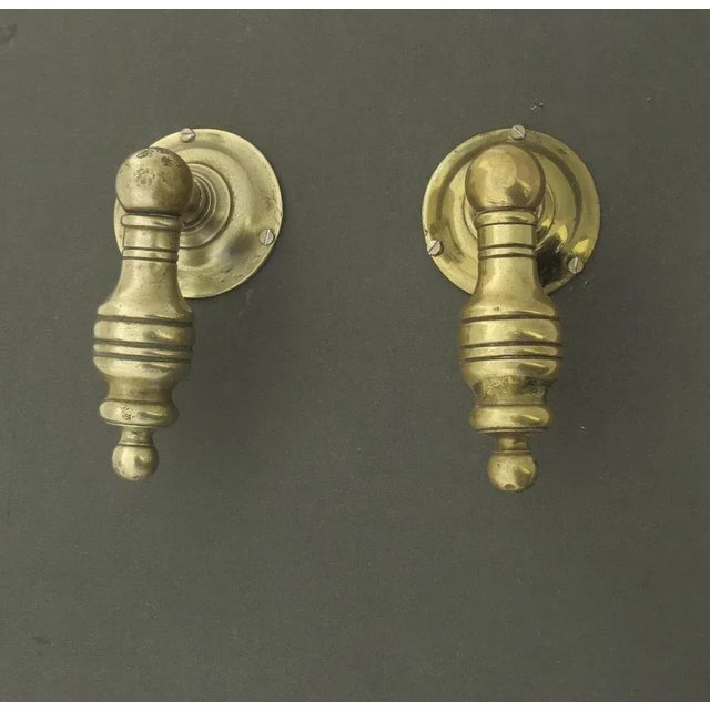 Pair of vintage brass great scale door knobs. Measure 6" long, 3 1/4" diameter of backplate, 3" projection. Handles need...