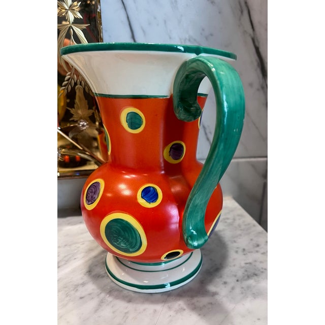 Beautiful art deco pitcher with vibrant yellow, blue, orange, purple, and green colors. It is stamped as Lostro 1QR...