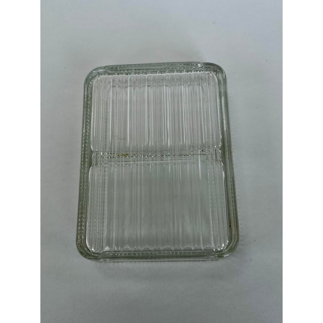 Glass dish with lines, great for catchall on top of desk or nightstand.