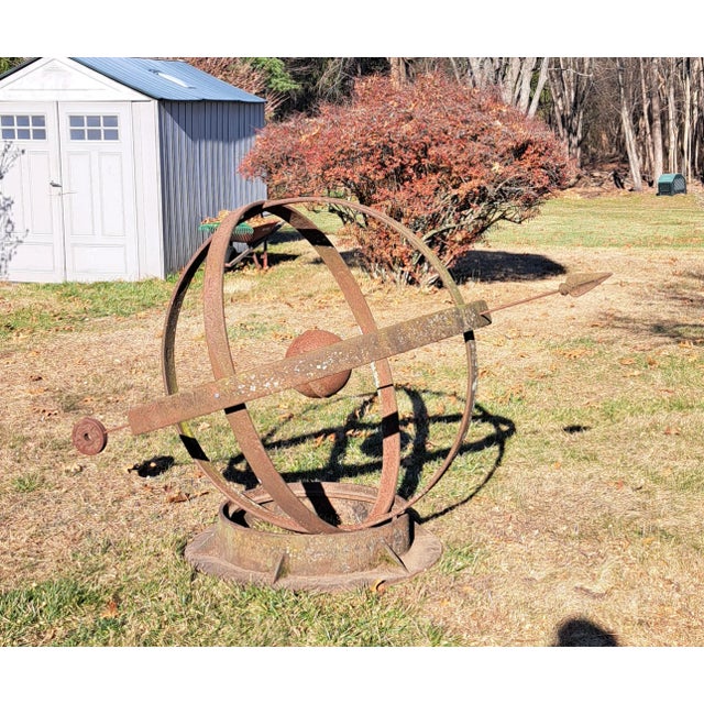 Large garden Armillary that sits on the ground. Would look great with plantings around it. The length of the arrow is...