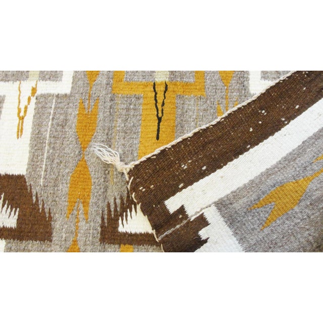 handmade Navajo tree figure Yei Rug. The weave is tight, the piece has a good weight and the design is clear with eleven...