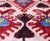"Capture the vibrant spirit of heritage craftsmanship with this masterfully hand-knotted silk velvet ikat lumbar pillow....